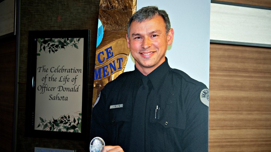 Image:A portrait of Officer Vancouver Police Department officer Donald Sahota is displayed as he is...